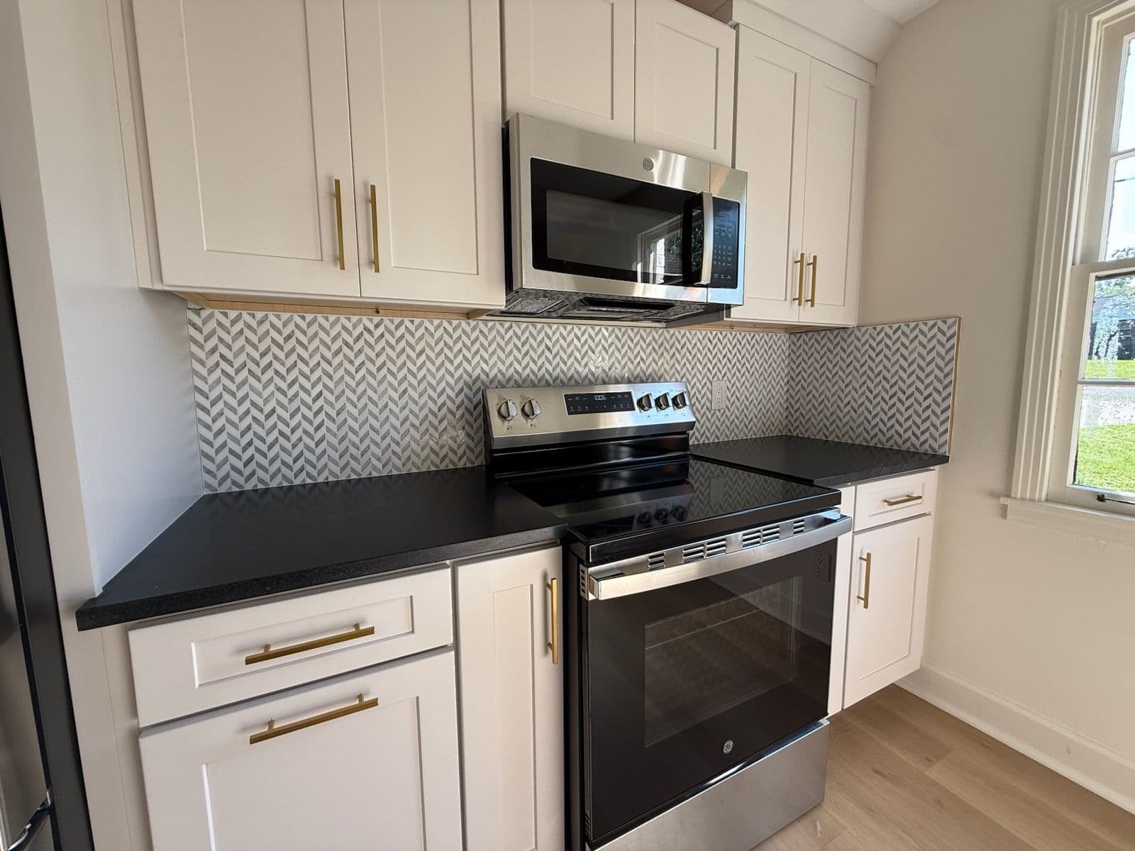 Modern Kitchen Upgrade with Herringbone Backsplash image